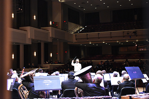 Maximo Ronquillo, Jr., conducting The NOVA Alexandria Band at The Rachel M. Schlesinger Center Concert Hall and Arts Center, March 3rd, 2022. Photo by Britt Conley.