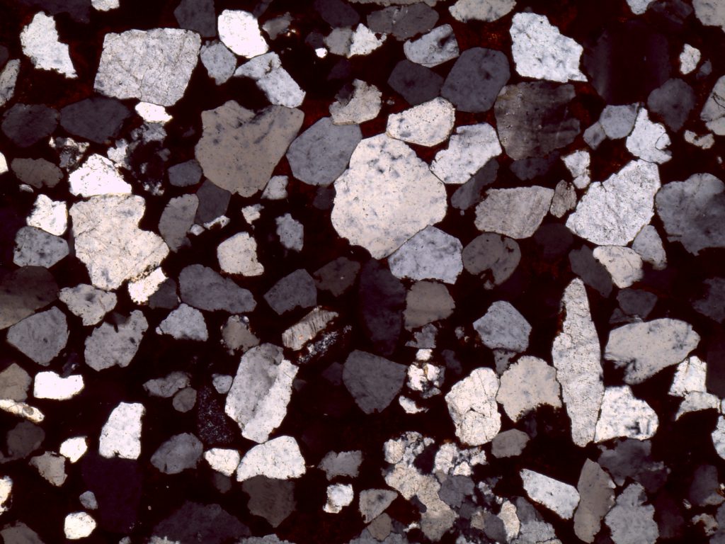 Conglomerate with hematite cement, crossed polars