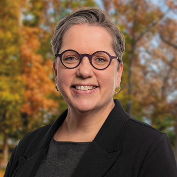 Dr. Anne Kress photographed against Virginia's beautiful fall foliage.