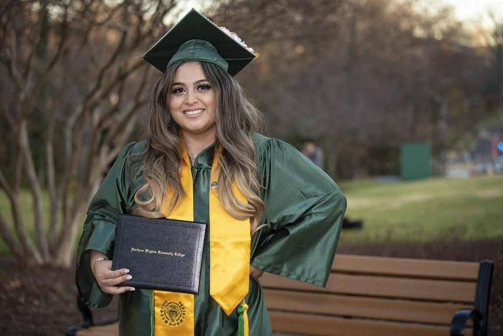 Brianna Ontiveros smiles wearing her cap and gown