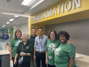 Photo of Loudoun Faculty and Staff as they welcome students back to campus. Left to right: Alison Malloy, Director of Campus Operations; Lisa Fukui, Evening Coordinator; Thien Le, Counseling Assistant; Kevin Amaya, High School Outreach Coordinator; Julie Leidig, Provost; Faith Lankford, Executive Assistant to the Provost