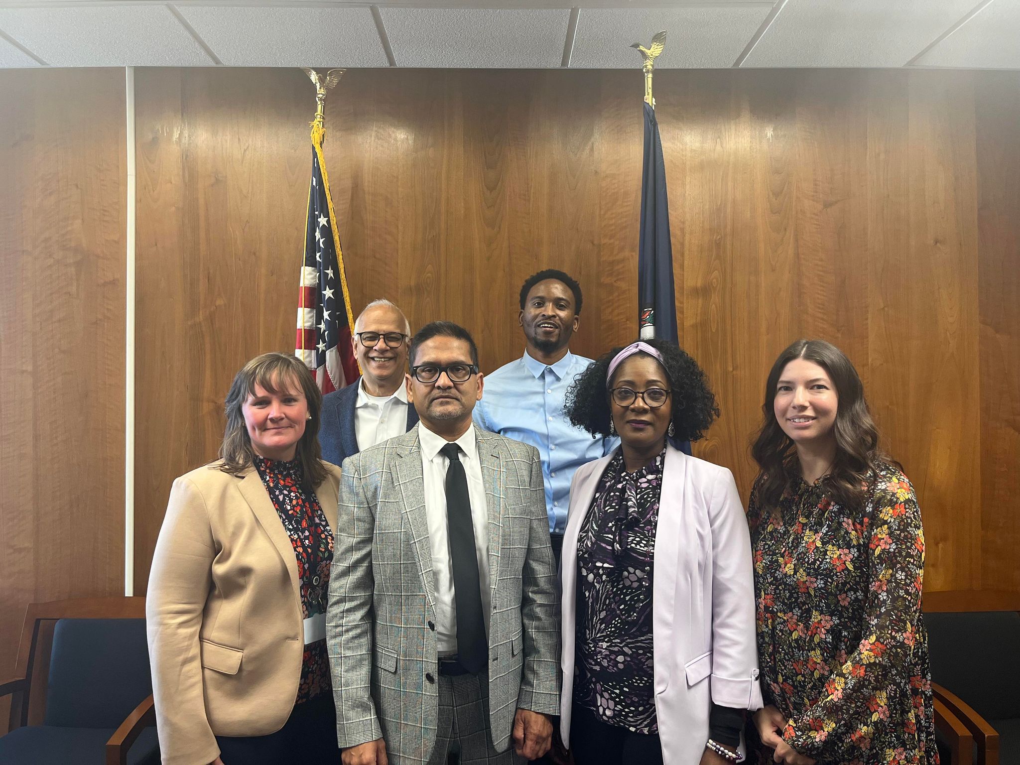 All six campus directors of operations pose together.