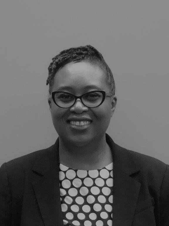 Black and white photo of a smiling Dr. Sherri Anna Brown