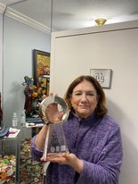 Holsonbake holds her Hall of Fame trophy.