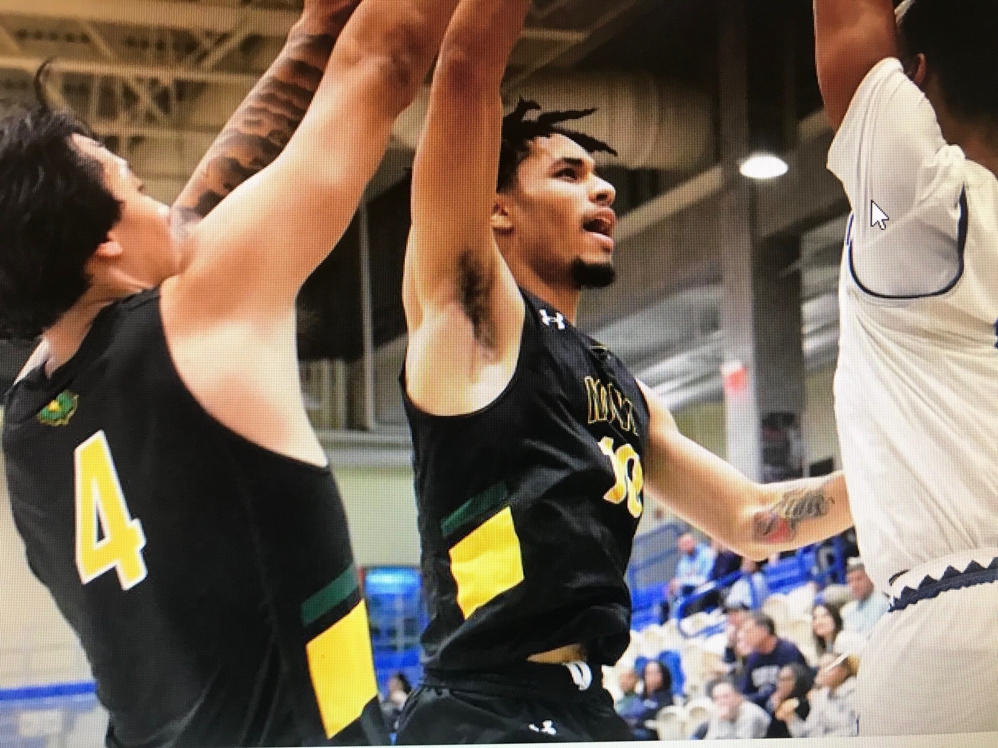 Screen shot photo of two NOVA Nighthawk men defending the basket.