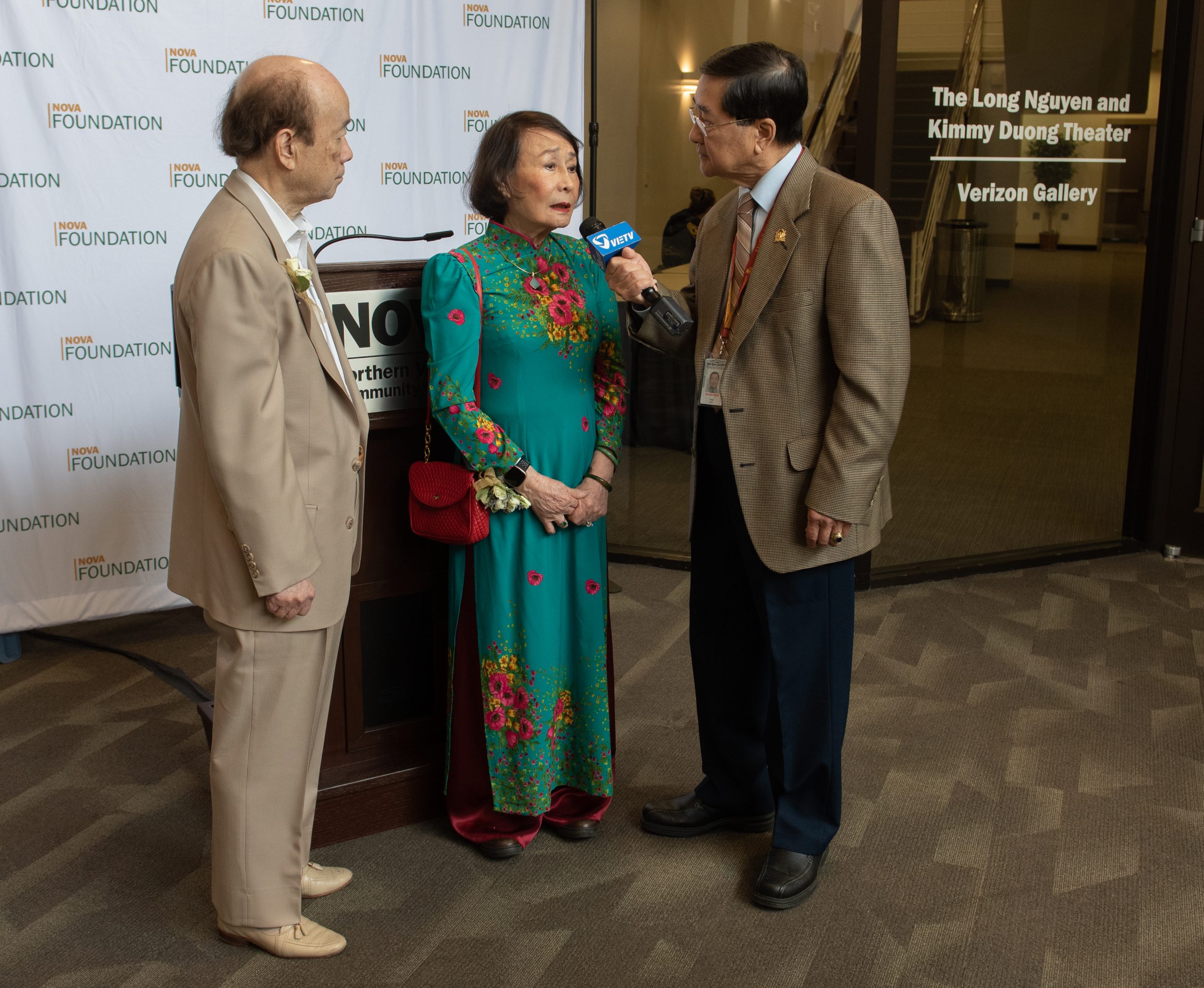 Long Nguyen and Kimmy Duong are interviewed by a reporter from Viet TV