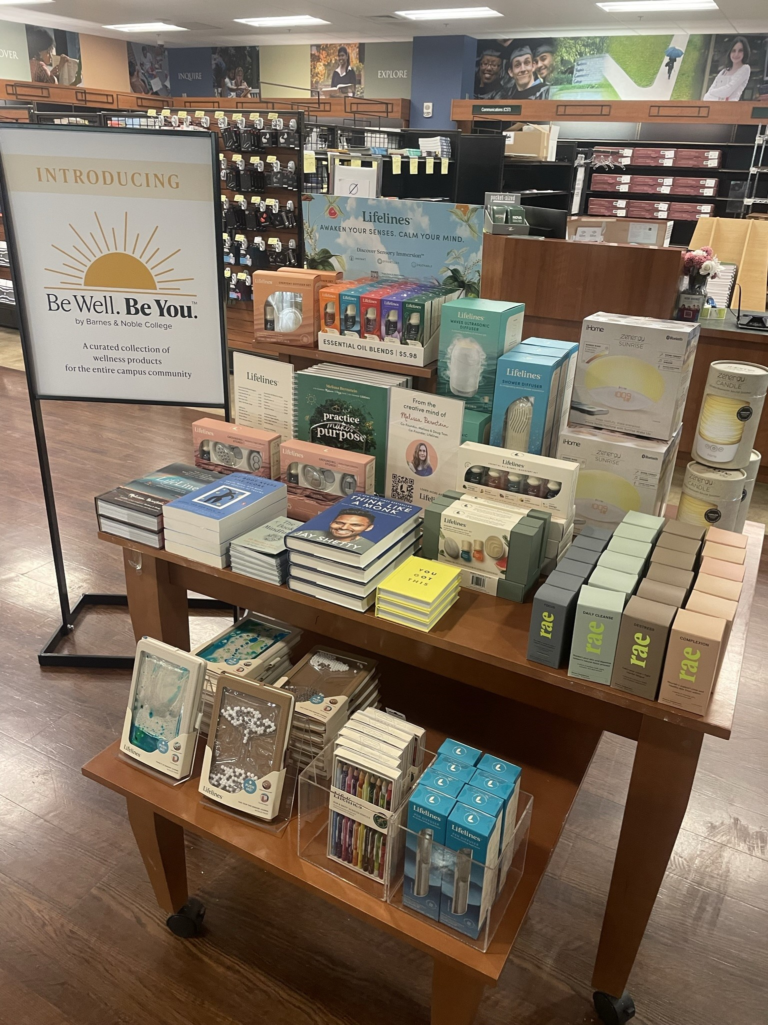 Photo of book display at a Barnes & Noble store with a poster of the Be Well. Be You Campaign.