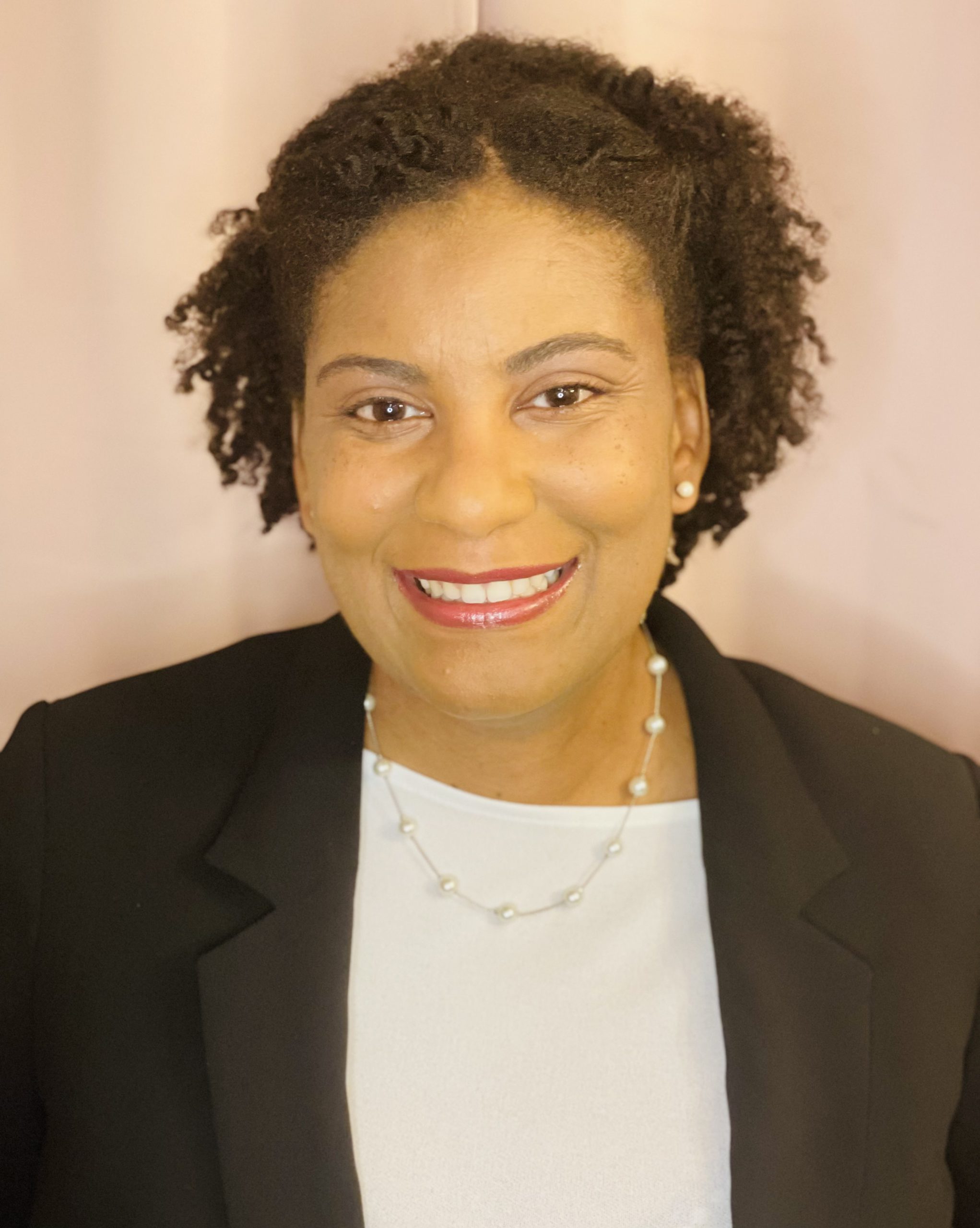 Camisha Parker in a smiling professional photo