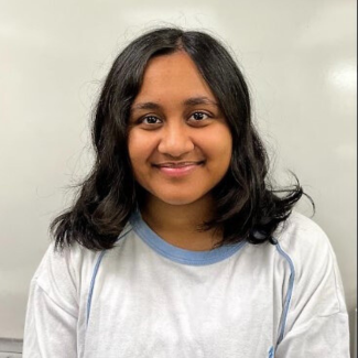 New graduate Sadia Annone smiles happily