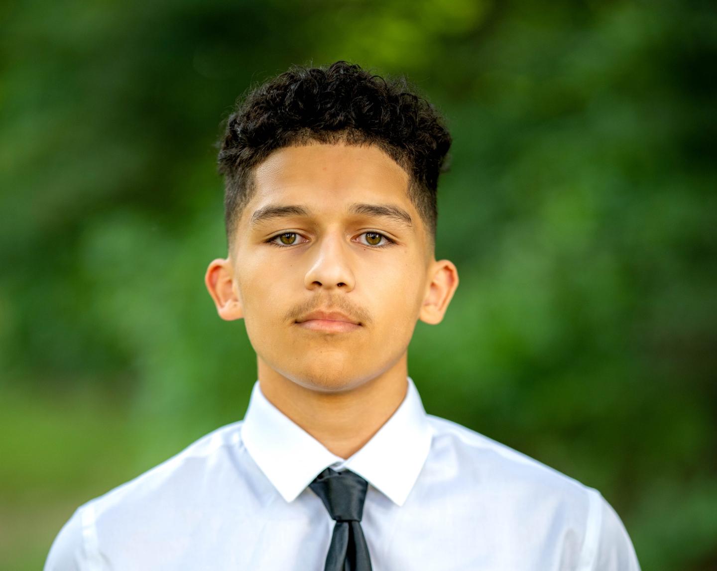 Year Up Student Anthony Hailey wearing a dress shirt and tie with