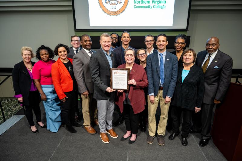 Pictured from left to right: Jenn Bristow, Development Manager, NOVA Educational Foundation; Pallas Washington, NCS Deputy Director; Dalia Palchik, Providence District representative, Fairfax County Board of Supervisors; James Bierman, Dranesville District representative, Fairfax County Board of Supervisors; Lloyd Tucker, NCS Director; Jeffrey McKay, Chairman, Fairfax County Board of Supervisors; Nigel Word, NOVA Director of Student Leadership; Dan Storck, Mount Vernon District representative, Fairfax County Board of Supervisors; Dr. Anne Kress, NOVA President; Dr. Diane Mucci, NOVA Annandale Campus Provost; James Walkinshaw, Braddock District representative, Fairfax County Board of Supervisors; Dr. Nathan Carter, NOVA Chief Diversity, Equity and Inclusion Officer; Karla Bruce, Fairfax County Chief Equity Officer; Catherine Novelli, NOVA Advisory Board Member; and Ambassador Joseph Huggins, Chair, NOVA College Board.