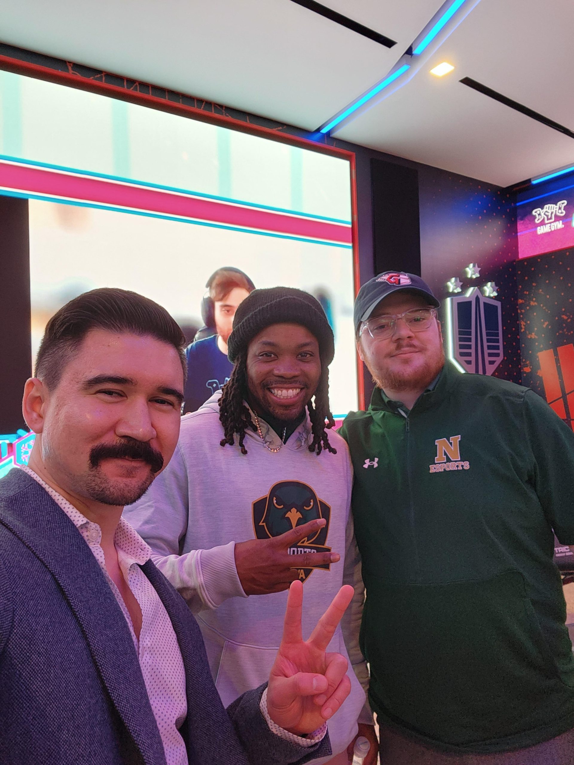 Jordan Whitaker, coach; CJ Jackson, associate director of college recreation and esports director and John O’Neil, coach, stand together in the esports lab at NOVA's Annandale Campus.