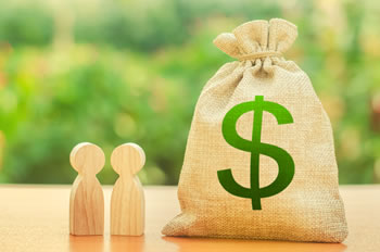 Two wood cut-outs of people next to a burlap bag with a green dollar sign on it.