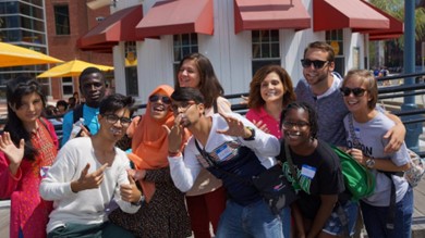 A group of visiting students and their hosts enjoy a sunny day shopping and eating at a local restaurant.