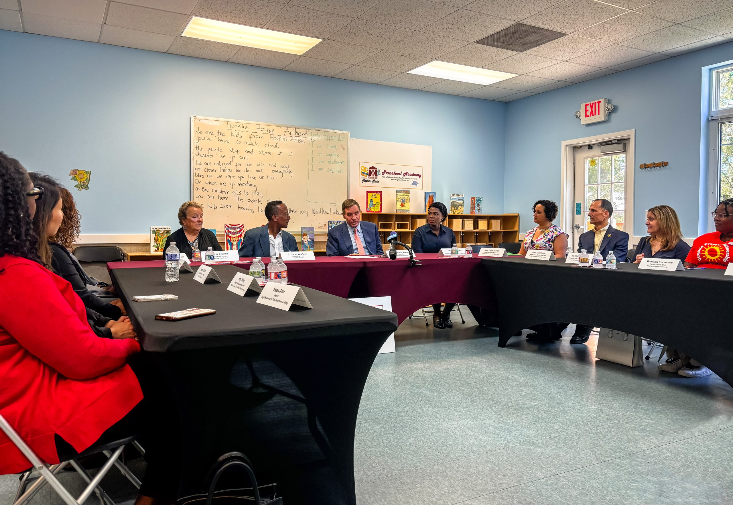 Senator Mark R. Warner (seated second from right at center table), speaks at a roundtable on the region's child care crisis at McNeil Preschool Academy in Alexandria on June 21. NOVA Early Childhood Development Professor Christine Schull (seated second from right at rightmost table) also attended the event.