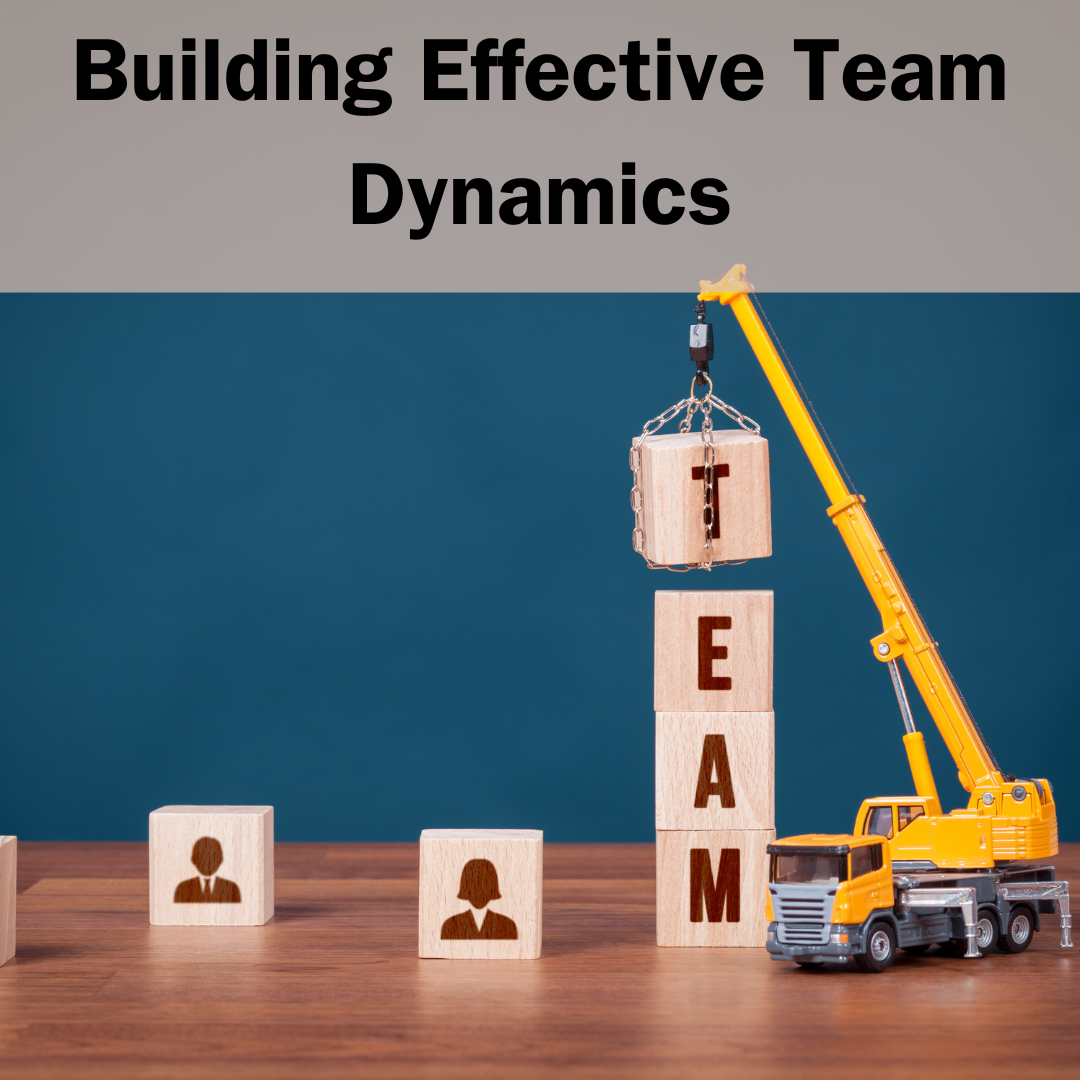 Visual: Grey band with black text: Building effective team dynamics. Blue background on a wood floor, a photo of a toy crane stack blocks that spell out the word TEAM.