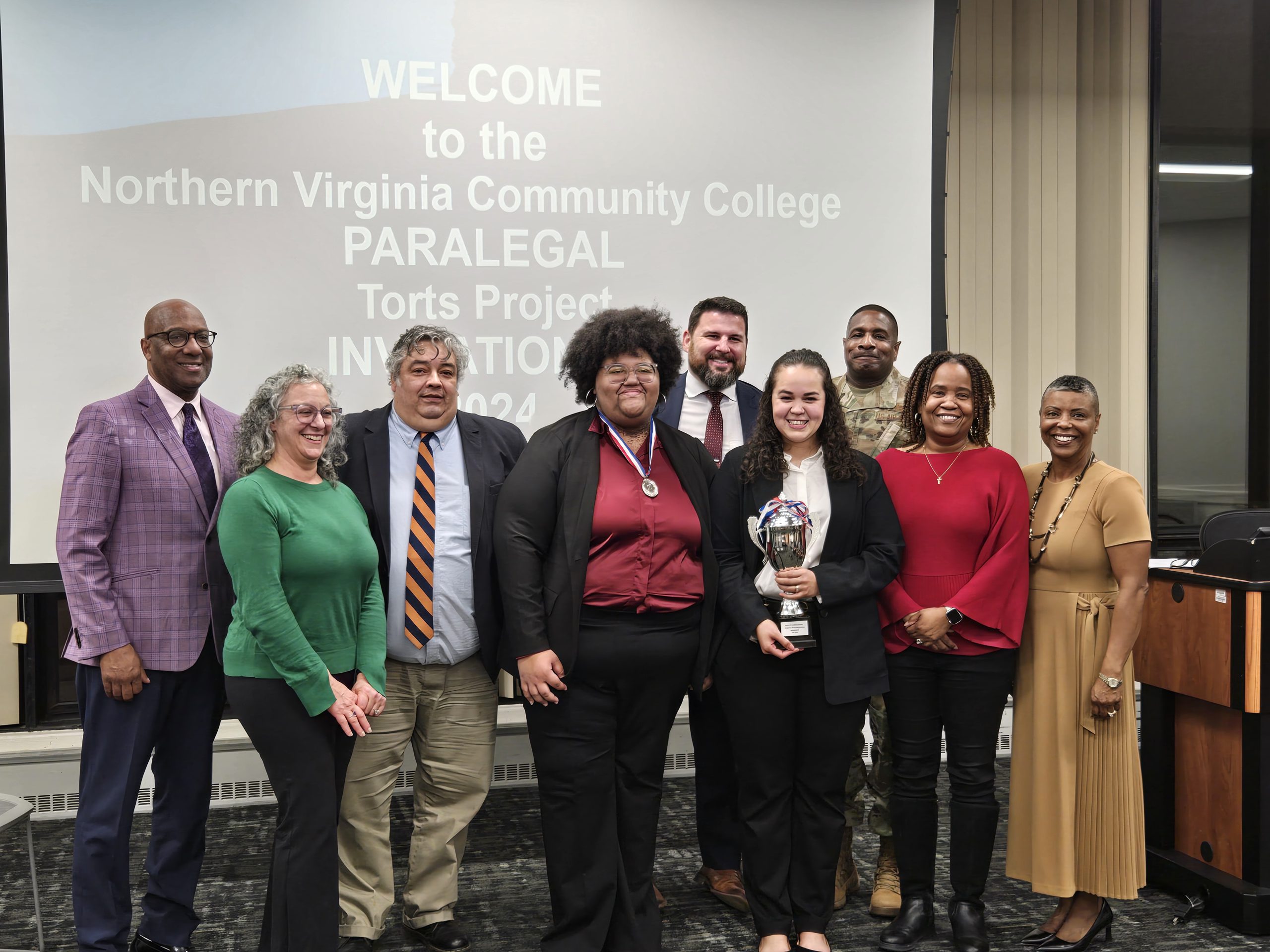 Photo Caption: Left to Right: Todd Pilot, Esq.; Professor Lisa Liewbow, Esq.; Luis Chinchilla, Esq.; Elysa Webster (2nd place); Maria Johnson (Champion); Sean Sherlock, Esq.; CMSgt Anthony Winbush (USAF Chief Reserve Paralegal); Professor Kelli Hebron, Esq.; Professor Alexis Stackhouse, Esq.